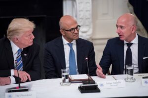 President Donald Trump speaks with Satya Nadella, Chief Executive Officer of Microsoft, and Jeff Bezos, Chief Executive Officer of Amazon during an American Technology Council roundtable in the State Dinning Room at the White House in Washington, DC on Monday, June 19, 2017.