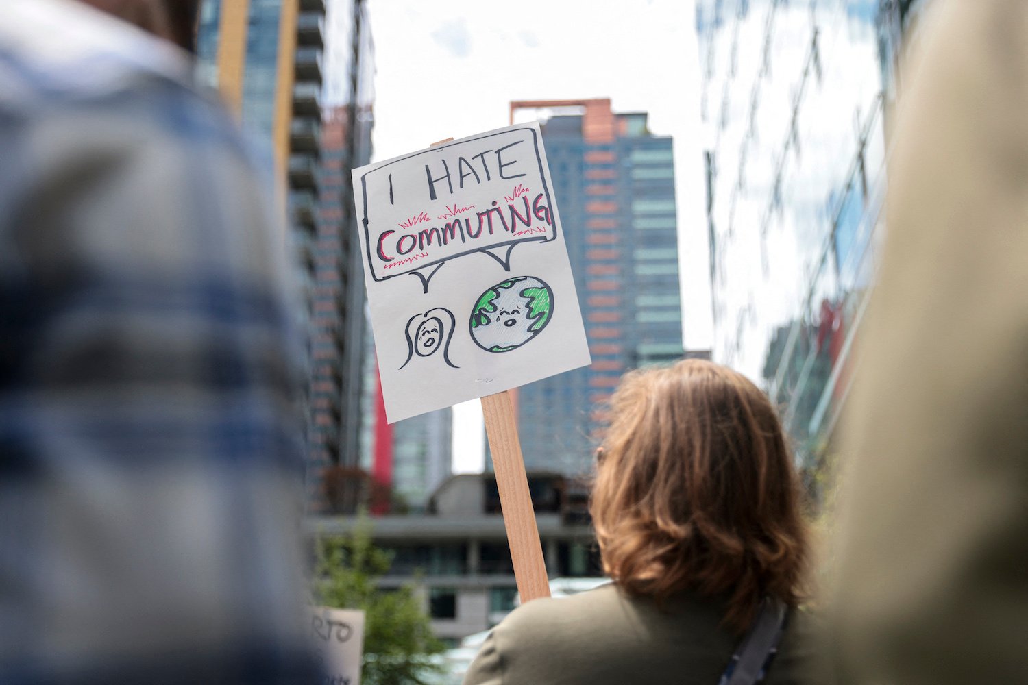 A protester holds a sign in front of Amazon's Seattle headquarters