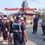 Babinsa Koramil 05/Banjit Serda Denara Deli, Amankan Upacara Pitra Yadnya Ngaben Masal Di Wilayah Kampung Bali Sadar Tengah, Kecamatan Banjit